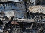 The site of a massive fire at a warehouse in Nazirabad, near Anandapur which broke out in the early hours of Monday (HT Photo/Samir Jana)