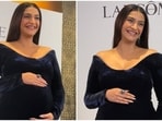 Sonam Kapoor shows off her baby bump in a dazzling gown at an event. 