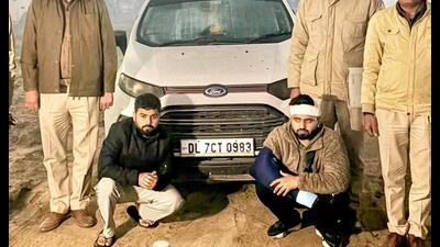 The arrested duo in police custody. (HT Photo) The arrested duo in police custody. (HT Photo)