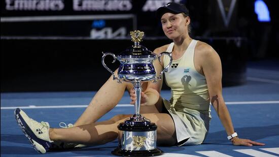 Kazakhstan's Elena Rybakina poses with the trophy. (REUTERS)