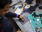 A labourer works on a leather fabric at a leather goods manufacturing unit in New Delhi, India, on January 27, 2026. (REUTERS) A labourer works on a leather fabric at a leather goods manufacturing unit in New Delhi, India, on January 27, 2026. (REUTERS)