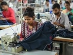By the time the government works out a trade deal with the US, a large number of workers in sectors such as textiles would have lost their jobs. (AFP)