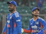 India's batting hero Ishan Kishan (R) with Sanju Samson (L) after winning the fifth and final T20I against New Zealand in Thiruvananthapuram