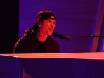 Canadian singer-songwriter Justin Bieber performs onstage during the 64th Annual Grammy Awards