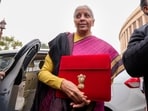 Finance Minister Nirmala Sitharaman shows the digital tablet, enclosed in a traditional red 'bahi-khata' style pouch.