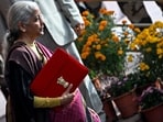 Finance minister Nirmala Sitharaman with Budget 2026 in Parliament on Sunday, February 1