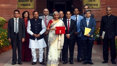 Nirmala Sitharaman's 2026 budget day saree was a stark contrast to the artistic Madhubani of 2025. Her off-white handloom silk saree, adorned with hand-painted Madhubani art, was gifted by Padma Shri awardee Dulari Devi; the saree featured fish motifs symbolising abundance and prosperity, highlighting the intricate craftsmanship of Bihar’s Mithila region. (File Photo/ ANI) Nirmala Sitharaman's 2026 budget day saree was a stark contrast to the artistic Madhubani of 2025. Her off-white handloom silk saree, adorned with hand-painted Madhubani art, was gifted by Padma Shri awardee Dulari Devi; the saree featured fish motifs symbolising abundance and prosperity, highlighting the intricate craftsmanship of Bihar’s Mithila region. (File Photo/ ANI)