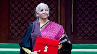 Union Finance Minister Nirmala Sitharaman shows the budget tablet as she arrives at the Parliament House. (ANI) Union Finance Minister Nirmala Sitharaman shows the budget tablet as she arrives at the Parliament House. (ANI)