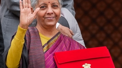 Finance minister Nirmala Sitharaman with the budget (PTI) Finance minister Nirmala Sitharaman with the budget (PTI)