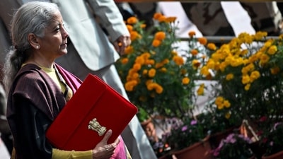 Finance minister Nirmala Sitharaman with Budget 2026 in Parliament on Sunday, February 1 (PTI) Finance minister Nirmala Sitharaman with Budget 2026 in Parliament on Sunday, February 1 (PTI)