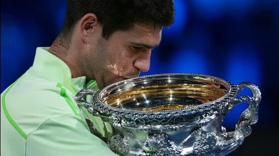 Carlos Alcaraz of Spain holds the Norman Brookes Challenge Cup after defeating Novak Djokovic of Serbia in the men's singles final at the Australian Open tennis championship in Melbourne, Australia, Sunday, Feb. 1, 2026. AP/PTI(AP02_01_2026_000665B) (AP)