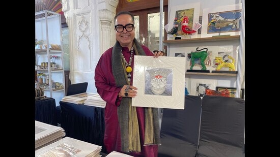 Kolkata’s Sounak Chakraverti with one of his artist’s work at Sanatkada