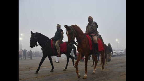 Police personnel kept vigil despite the fog at the Sangam on the occasion of the ‘Maghi Purnima’ festival (PTI)