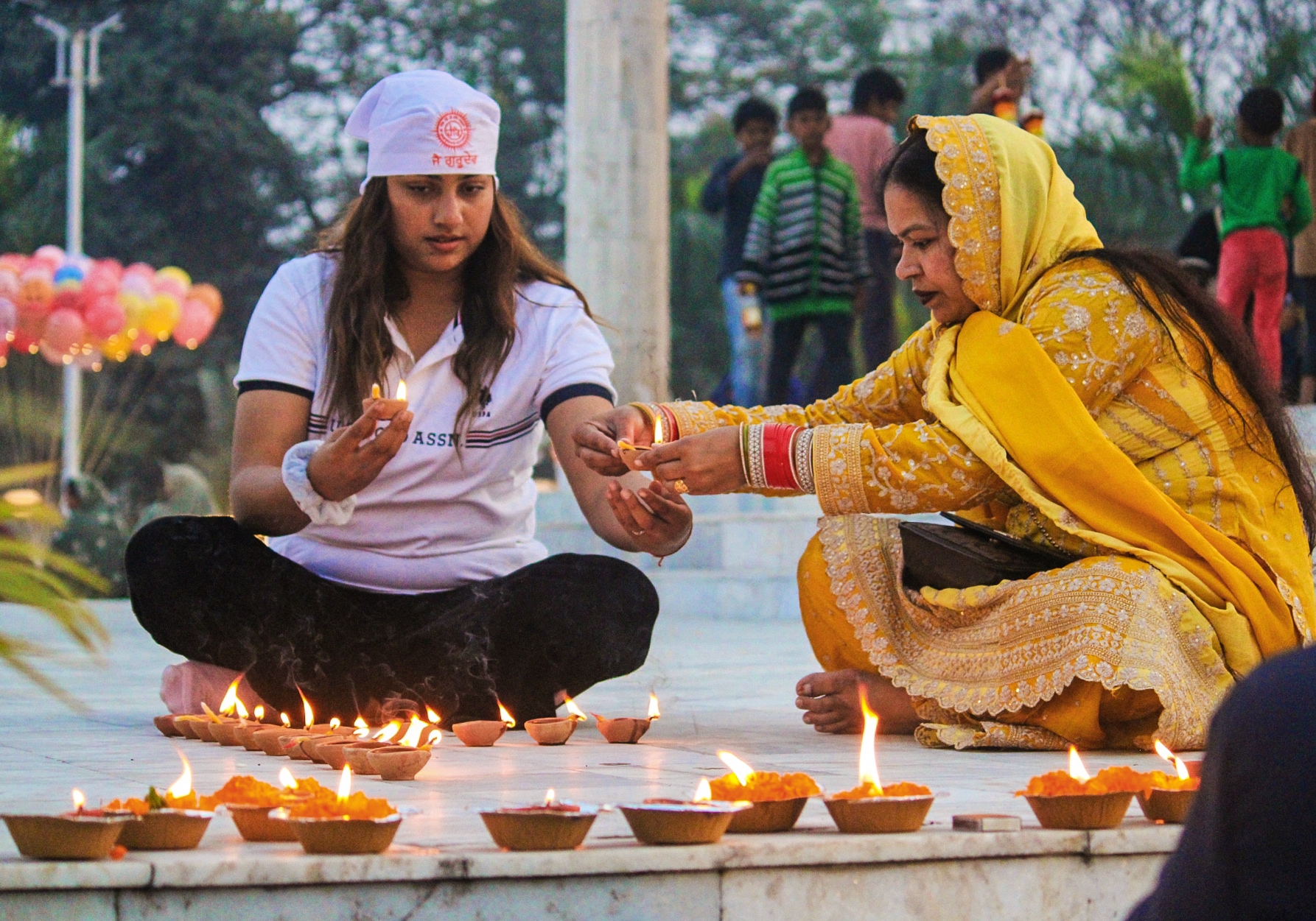 Devotees light diyas at Sant Ravidas Park on the eve of Guru Ravidas Jayanti, in Varanasi on Saturday. (ANI Photo) Devotees light diyas at Sant Ravidas Park on the eve of Guru Ravidas Jayanti, in Varanasi on Saturday. (ANI Photo)