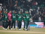 Pakistan's Salman Ali Agha, second right, and teammates walk off the field on the end of a T20I match against Australia, in Lahore