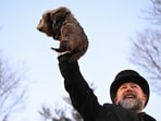 Groundhog Day 2026: Handler A. J. Dereume holds Phil the groundhog, as Phil makes his prediction on how long winter will last, during the Groundhog Day festivities, at Gobbler's Knob in Punxsutawney, Pennsylvania, U.S., February 2, 2026. REUTERS/Alan Freed