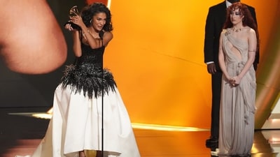 Olivia Dean opted for timeless elegance in a black-and-white Chanel gown with intricate beaded embroidery, feather detailing, and a classic ball skirt. She won the Best New Artist award during the 68th annual Grammy Awards. (Chris Pizzello/Invision/AP) Olivia Dean opted for timeless elegance in a black-and-white Chanel gown with intricate beaded embroidery, feather detailing, and a classic ball skirt. She won the Best New Artist award during the 68th annual Grammy Awards. (Chris Pizzello/Invision/AP)