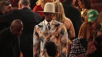 Jamie Foxx is seen in the audience during the 68th annual Grammy Awards on Sunday, February 1, dressed in a printed sharp suit and a cowboy hat to add the drama. (Chris Pizzello/Invision/AP) Jamie Foxx is seen in the audience during the 68th annual Grammy Awards on Sunday, February 1, dressed in a printed sharp suit and a cowboy hat to add the drama. (Chris Pizzello/Invision/AP)