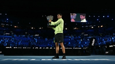 Carlos Alcaraz poses with the Norman Brookes Challenge Cup after defeating Novak Djokovic in the men's singles final of the Australian Open tournament (AFP) Carlos Alcaraz poses with the Norman Brookes Challenge Cup after defeating Novak Djokovic in the men's singles final of the Australian Open tournament (AFP)