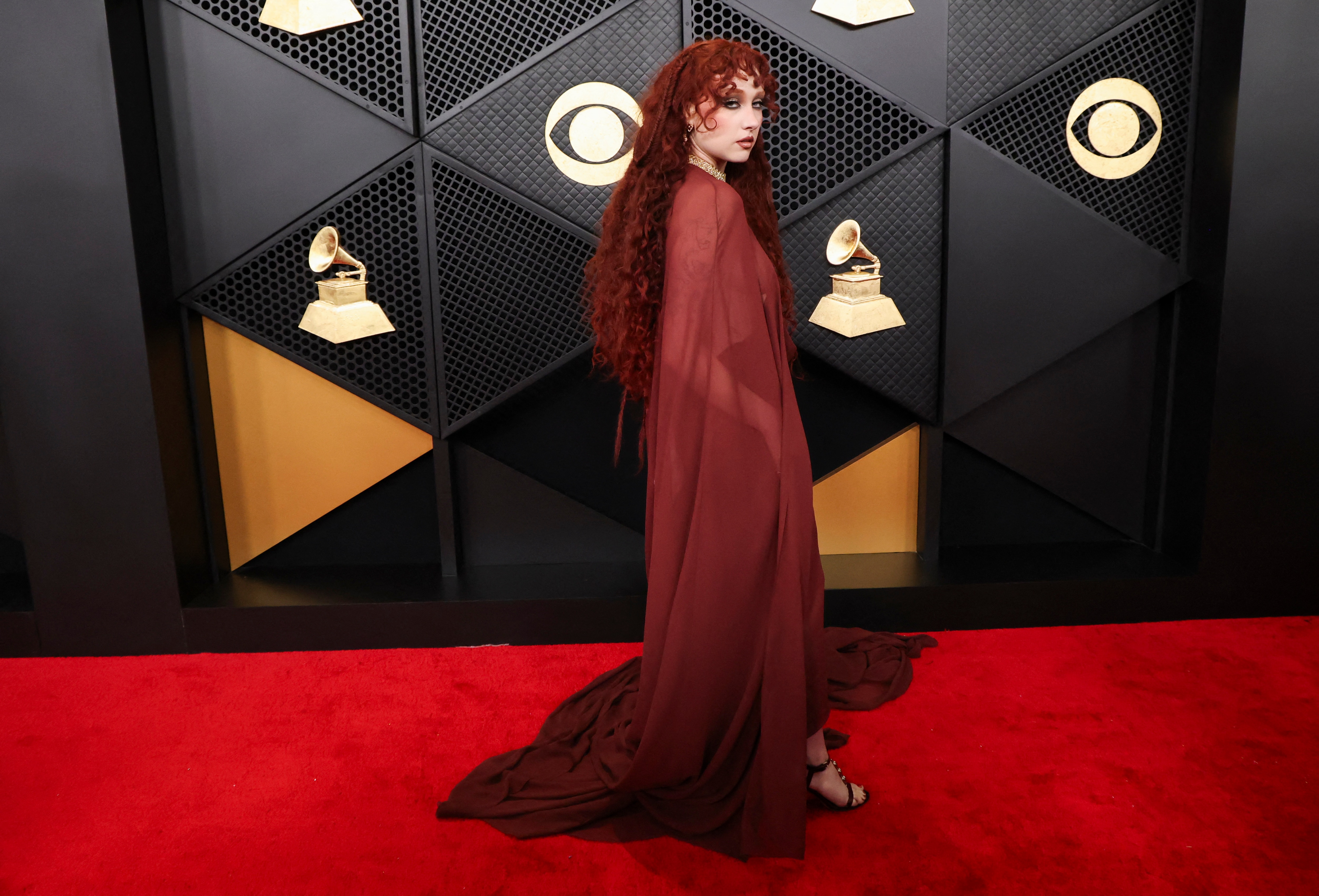 Chappell Roan poses on the red carpet during the 68th Annual Grammy Awards in a naked dress. (REUTERS)