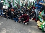Farmers under the banner of the BKU (Sidhupur) along with the villagers of Jamsher village staged a protest against the construction of a bio-CNG plant in the fodder market of Jamsher Dairy Complex on Monday. (HT Photo)