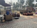 Ongoing LPG cylinder distribution inside a public park near Cheema Chowk in Ludhiana on Tuesday. (Gurpreet Singh/HT)