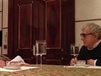This undated, redacted photo released by Democrats on the House Oversight Committee shows Jeffery Epstein, left, and Woody Allen, far right. 