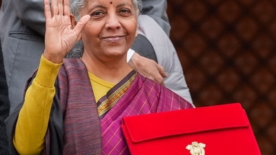 Finance minister Nirmala Sitharaman with the union budget (PTI) Finance minister Nirmala Sitharaman with the union budget (PTI)