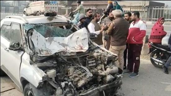 The mangled remains of the car that rammed into two scooters, killing four men near Bhangala in Mukerian sub division around Monday midnight. (HT Photo)