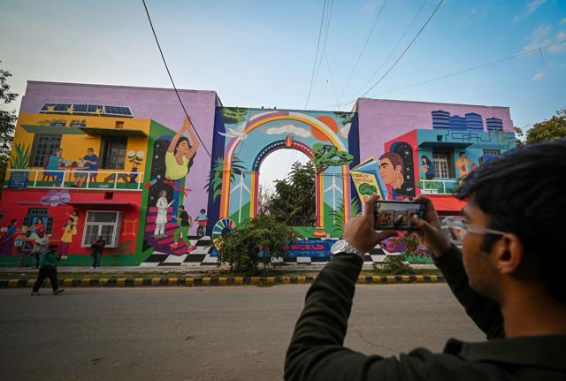 Hundreds gathered at Lodhi Colony as artists from India and abroad added works, with children, residents and passersby joining workshops and walks. (Sanchit Khanna/HT) Hundreds gathered at Lodhi Colony as artists from India and abroad added works, with children, residents and passersby joining workshops and walks. (Sanchit Khanna/HT)