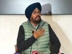 AAP’s Punjab chief spokesperson Kuldeep Singh Dhaliwal addressing a press conference in Chandigarh. (HT)