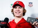 Canada's Gavin McKenna speaks to media following a practice. Canada's Gavin McKenna speaks to media following a practice.
