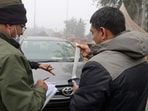 Delhi Traffic Police personnel check vehicles during a routine enforcement drive.
