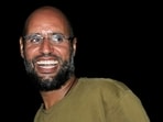 File image: Saif al-Islam, the son of Libyan leader Muammar Gaddafi, smiles as he greets supporters in Tripoli in this August, 2011 pic