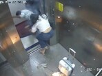 The flames briefly covered the CCTV camera, and seconds later, the woman and two men were seen rushing out of the elevator.