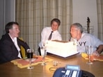 Peter Mandelson sits with late financier and convicted sex offender Jeffrey Epstein, as he blows out the candles on a cake.