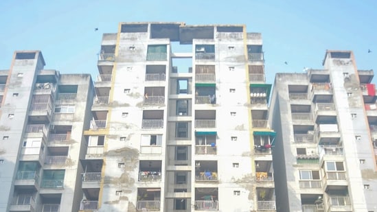 Ghaziabad: People gather after three minor sisters allegedly jumped off the balcony of a ninth-floor flat and died. (PTI)