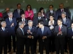 US Secretary of State Marco Rubio (C) shakes hands after posing for a "family photo" with the 55 government officials, including EAM S Jaishankar.