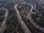 Vehicles stuck in a traffic jam on the Mumbai-Pune Expressway after a gas tanker overturned in the Khandala Ghat section, in Raigad district, Maharashtra. (PTI)