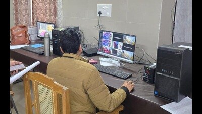 A team member monitors strongrooms at different examination centres in state, from the control room in UP Board headquarters in Prayagraj on Thursday. (HT Photo) A team member monitors strongrooms at different examination centres in state, from the control room in UP Board headquarters in Prayagraj on Thursday. (HT Photo)