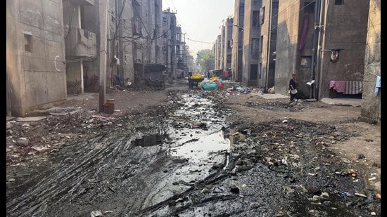 Flooded sewage and garbage lying in a streets in Giaspura, Ludhiana, on Thursday. (Gurpreet Singh/HT)
