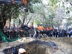 Delhi police dragging out the bike from the pit that it fell in.