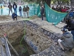 Officials from forensic team inspect the accident site on Friday. (Sanjeev Verma/HT Photo)