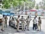 The Bengaluru police stand guard at BMTC bus stand, as coronavirus cases surge in Bengaluru, Wednesday