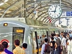 Passengers board a train at a metro station in Delhi. (HT Photo) Passengers board a train at a metro station in Delhi. (HT Photo)