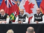 Toronto police service chief Myron Demkiw, left, is joined by York regional police chief Jim MacSween, centre, and YRP deputy chief Ryan Hogan at a news conference to announce the results of 'Project South,' a lengthy investigation into organised crime and corruption at York Regional police headquarters in Aurora, Ontario on Thursday. (AP)