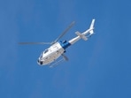 A U.S. Customs and Border Protection helicopter flies over the home of Nancy Guthrie, the 84-year-old mother of U.S. journalist and television host Savannah Guthrie, who was reported missing over the weekend, in Tucson, Arizona, U.S., February 6, 2026.