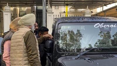 Police personnel investigate the Thar jeep belonging to Aam Aadmi Party leader Lucky Oberoi after he was shot dead by unidentified assailants outside a gurudwara in Jalandhar’s Model Town area on Friday morning. (PTI Photo) Police personnel investigate the Thar jeep belonging to Aam Aadmi Party leader Lucky Oberoi after he was shot dead by unidentified assailants outside a gurudwara in Jalandhar’s Model Town area on Friday morning. (PTI Photo)