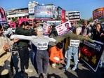People under the banner of Rashtriya Parshuram Sena stage a protest against filmmaker Neeraj Pandey and actor Manoj Bajpayee over the title of their upcoming film Ghooskhor Pandat, in Prayagraj, Friday. (PTI Photo) People under the banner of Rashtriya Parshuram Sena stage a protest against filmmaker Neeraj Pandey and actor Manoj Bajpayee over the title of their upcoming film Ghooskhor Pandat, in Prayagraj, Friday. (PTI Photo)