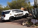 A Pima County Sheriff’s Office deputy pulls into the driveway of the home of Nancy Guthrie.